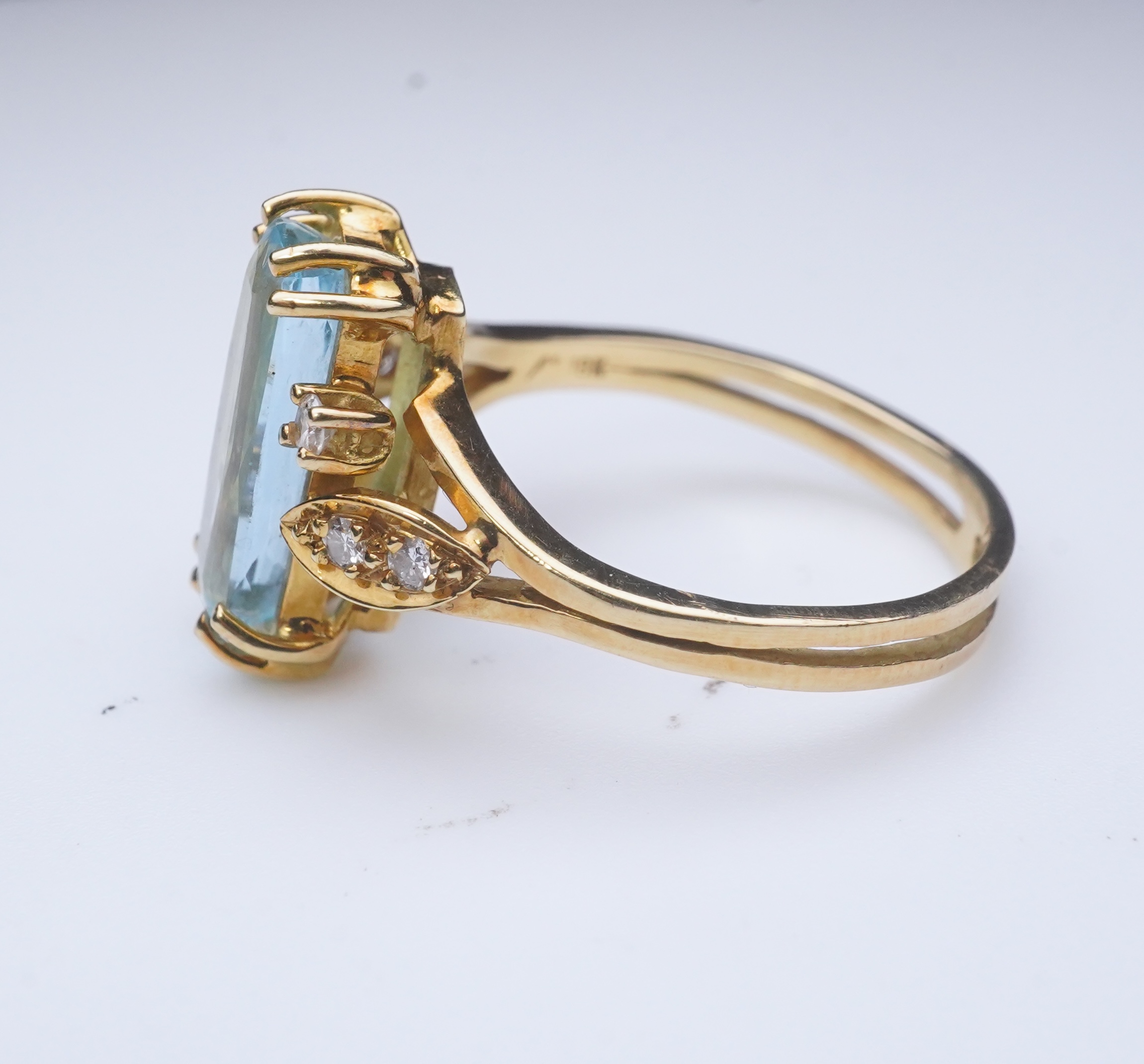 An aquamarine and diamond ring